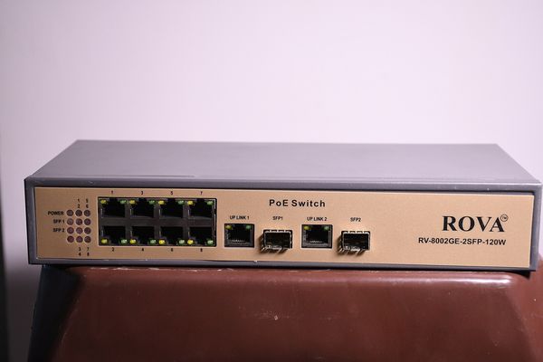 An eight-port network switch with cables connected