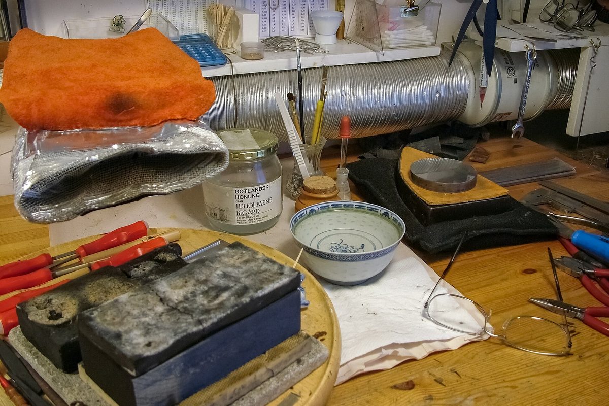 Hand tools laid out in a jewellery workshop