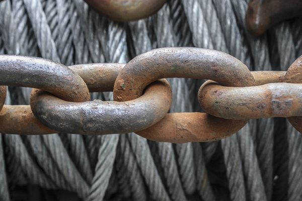 A close-up of interlocking metal chain links