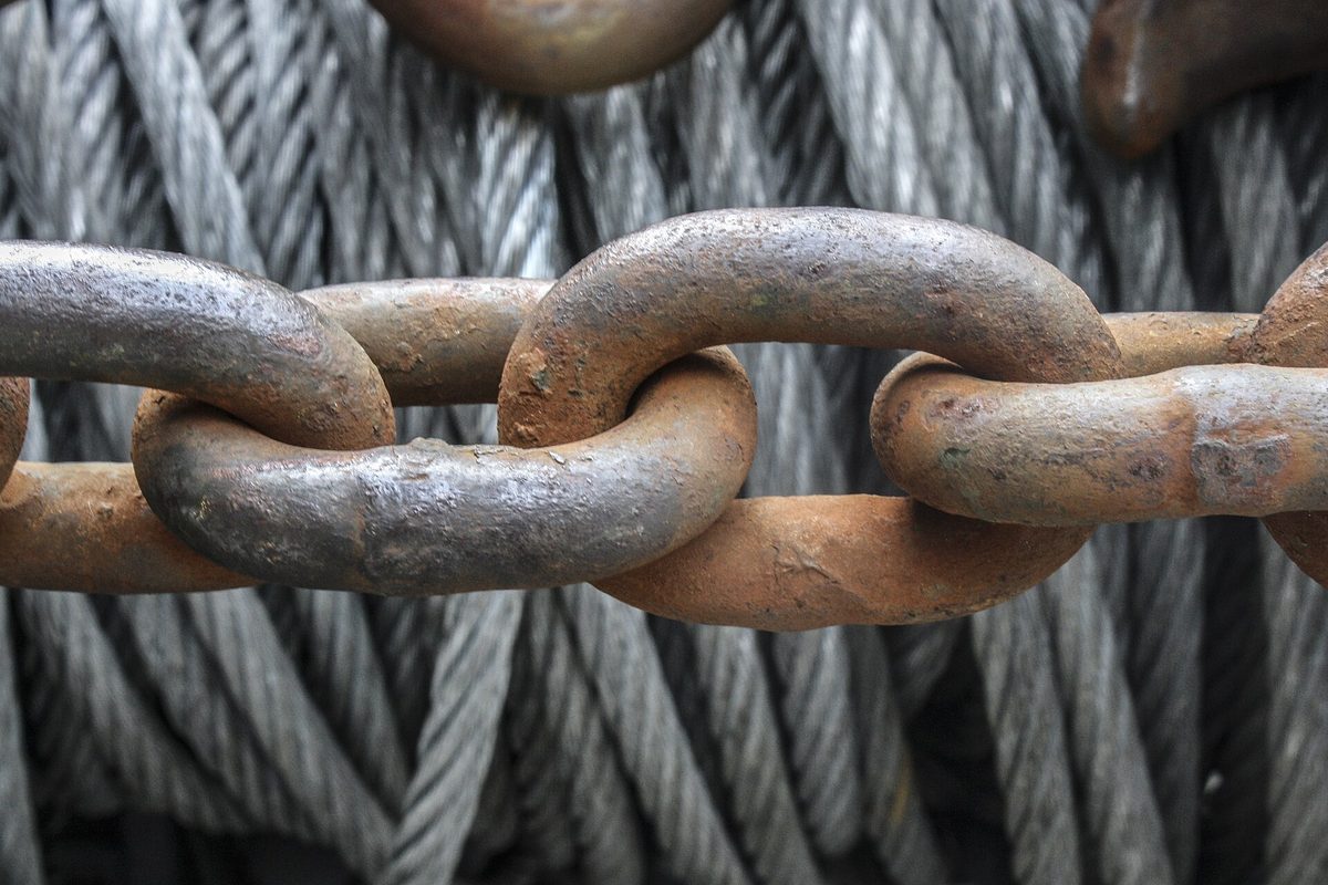 A close-up of interlocking metal chain links