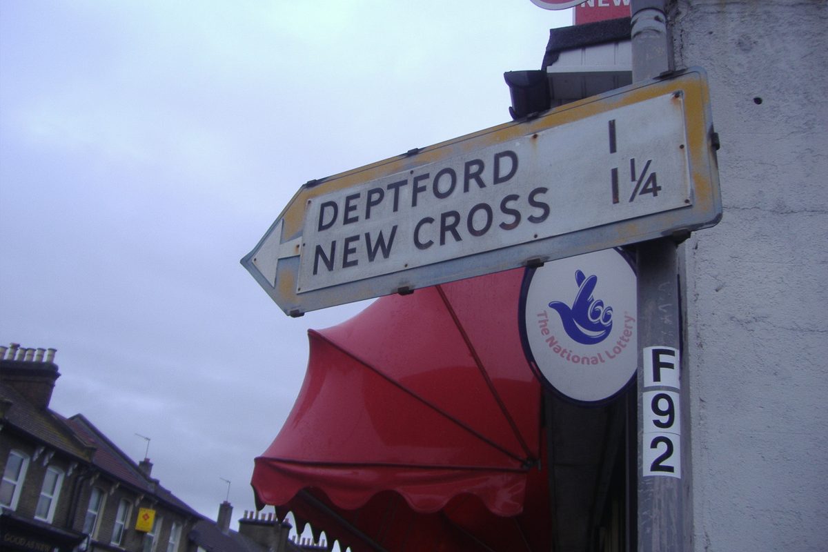 A vintage pre-Worboys direction arrow road sign